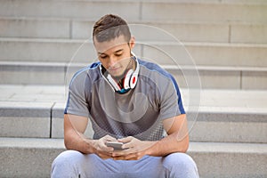 Smartphone cell phone listening to music young latin man listen