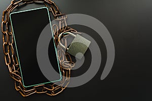 Smartphone with chain and lock. the concept of forbidden