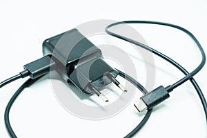 Smartphone charger with USB cable, isolated on white background
