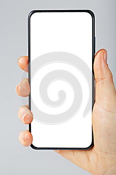 Smartphone with a clean white screen in your hand close-up.