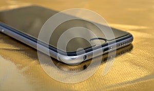 Smartphone Closeup on Gold Background