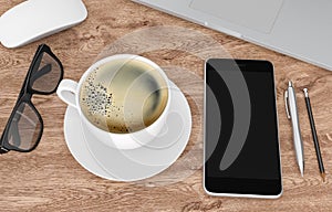 Smartphone, coffee cup and other devices on wood office desk, 3d rendering