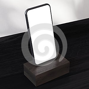 Smartphone on a dark wooden pedestal corner