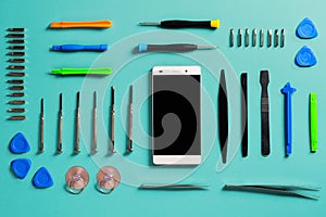 Smartphone disassembly tools, arranged. DIY project.