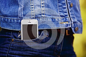 Smartphone in everyday life. phone in jeans pocket.