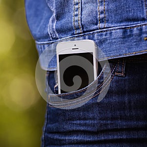 Smartphone in everyday life. phone in jeans pocket.