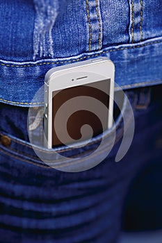 Smartphone in everyday life. phone in jeans pocket.