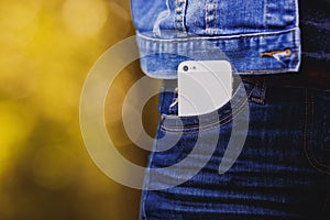 Smartphone in everyday life. phone in jeans pocket.