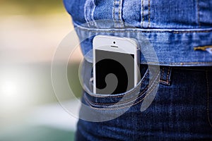 Smartphone in everyday life. phone in jeans pocket.