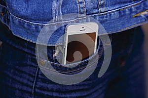 Smartphone in everyday life. phone in jeans pocket.