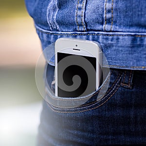 Smartphone in everyday life. phone in jeans pocket.