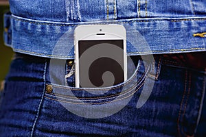 Smartphone in everyday life. phone in jeans pocket.