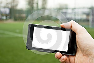 Smartphone and football pitch