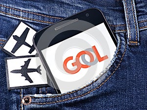 Smartphone with Gol Linhas Areas logo on the screen. Gol Linhas Areas is a Brazilian aviation airline photo