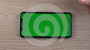 Smartphone green screen, green screen mockup, swipe up, scroll down gesture