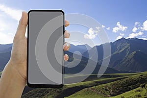 Smartphone with Grey Screen Placeholder. POV View of a Tourist Vertically Holding a phone