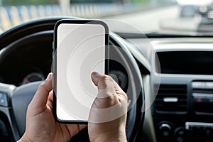 smartphone in hand close-up, inside the car at the wheel. mockup, template