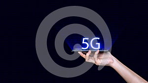 Smartphone in hand and 5G network wireless systems wireless devices
