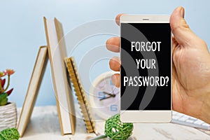 Smartphone in hand with the inscription Forgot your password