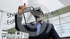Smartphone icon and social media concept texts over african american senior man wearing vr headset