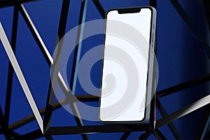 Smartphone mockup on a wire metallic structure