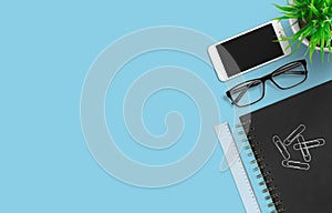 Smartphone and office accessories on colorful background. Modern wordspace. top view. Worplace concept.