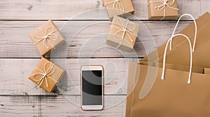 smartphone paper bags and giftbox on isolated background with copyspace, Online shopping concept