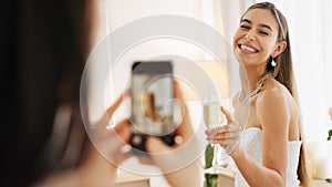 Smartphone photography of bride with champagne glass for wedding celebration to post on social media app. Smile portrait