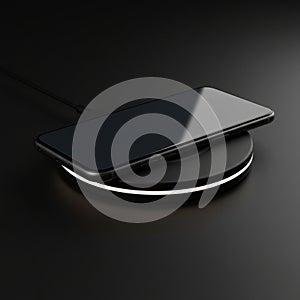 A smartphone is positioned on a round wireless charging pad on a black surface. The