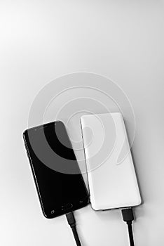 Smartphone and power bank during wired charging