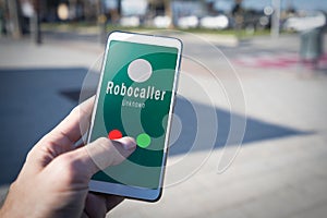Smartphone showing a call from a robocaller on screen