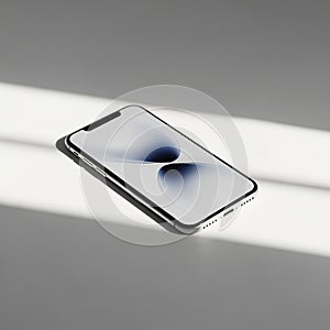 A smartphone with a sleek design is placed on a smooth, white surface. The screen