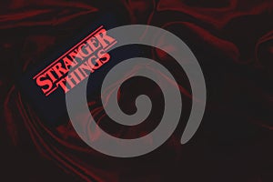 Smartphone with the Stranger Things logo. Stranger Things