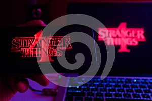 Smartphone with the Stranger Things logo. Stranger Things
