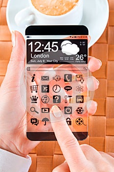 Smartphone with transparent screen in human hands.