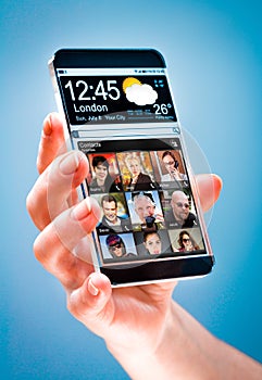 Smartphone with transparent screen in human hands.