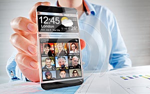 Smartphone with transparent screen in human hands.