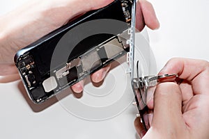 The smartphone was damages and need to repair which tools smartphone that stand on white background