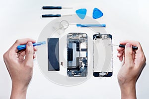 The smartphone was damages and need to repair which tools smartphone that stand on white background photo