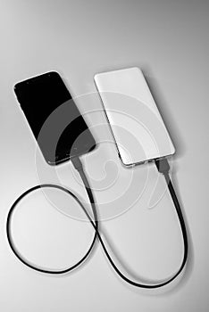 Smartphone during wired charging from the power bank battery