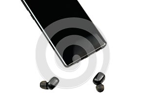 Smartphone with wireless headphones isolated white background
