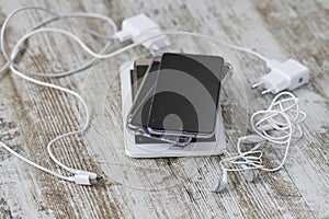 Smartphones pile and cable