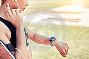 Smartwatch, pulse and woman runner training for a race, competition or marathon on a field. Fitness, sports and healthy