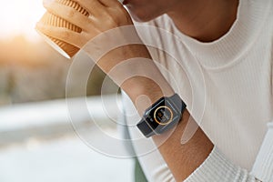 Smartwatch showing calorie alert app on woman hand