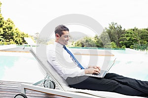 Smarty dressed man using laptop