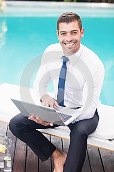 Smarty dressed man using laptop