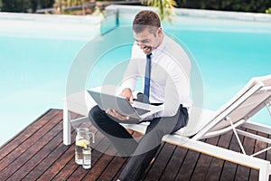 Smarty dressed man using laptop