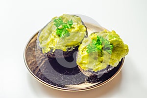 Smashed avocado,  smother avocado with lemon juice served on the for brunch