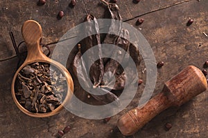 Carob pods on wood