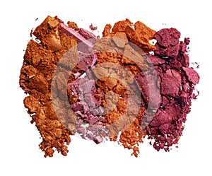 Smashed dark eyeshadows isolated on white background